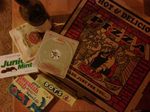 Pizza box with Redbox movie, Dots, and Junior Mints