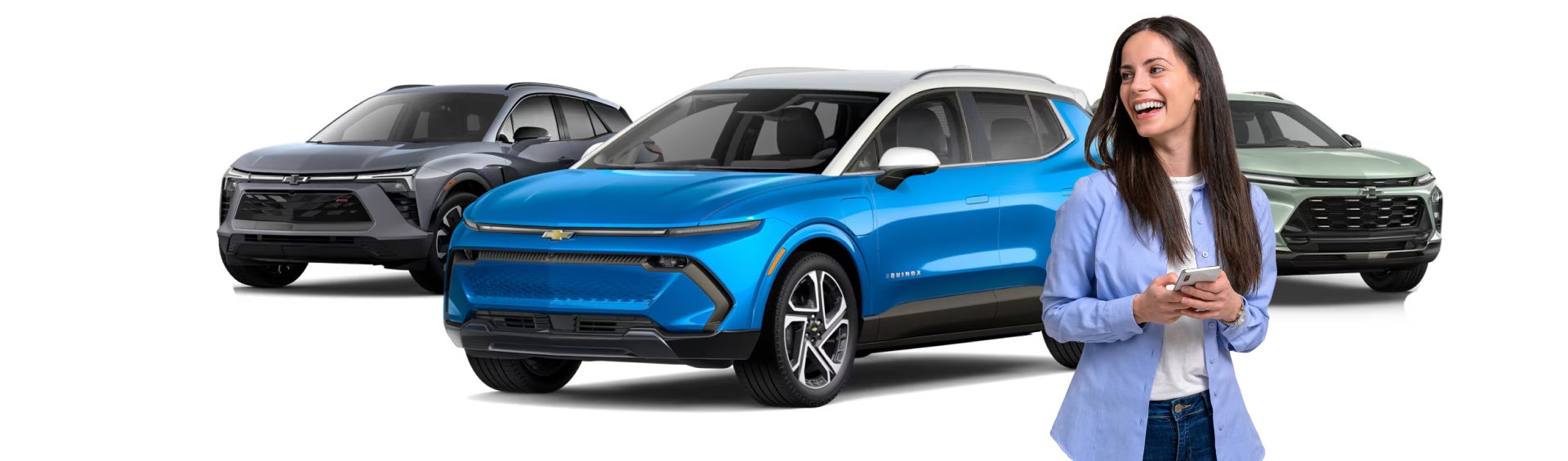 Woman on phone standing infront of three chevrolet suv